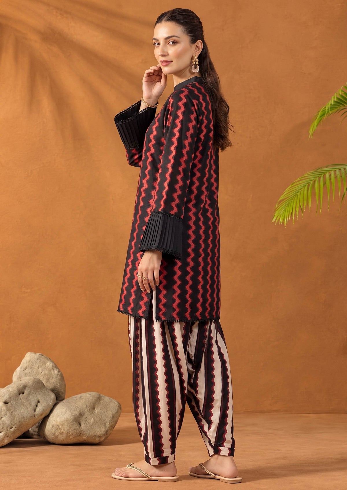 Back side view of Crimson Ripple stitched lawn suit showing black and red wave print shirt and coordinated printed shalwar