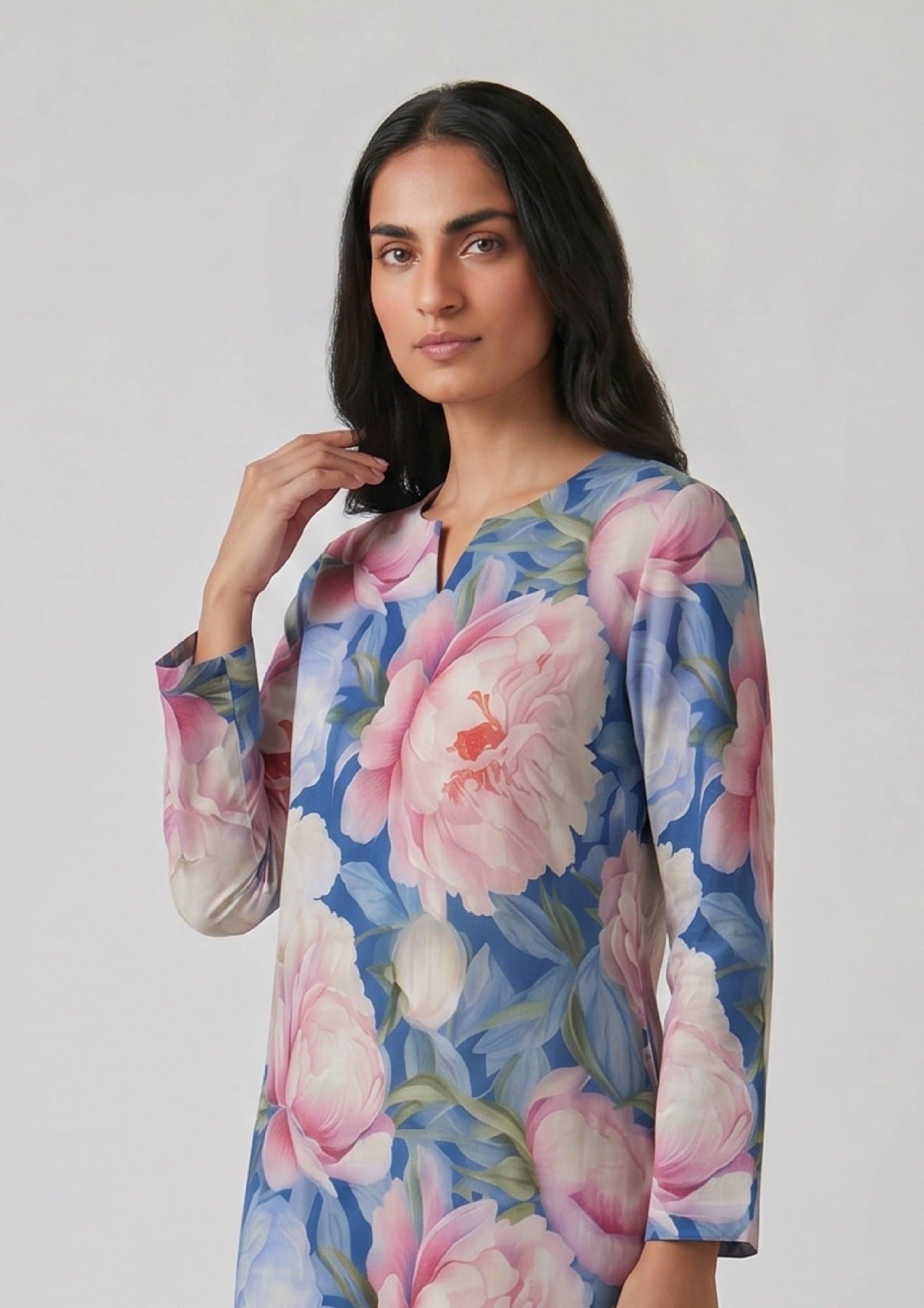 Sapphire Petals printed lawn co ord set seated view by Mirasl with pastel floral shirt and printed trouser.