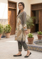 Close up of Sable Tropics printed lawn co-ord set by Mirasl with black dotted pattern, palm motifs, beige ornamental details, and ethnic border design.