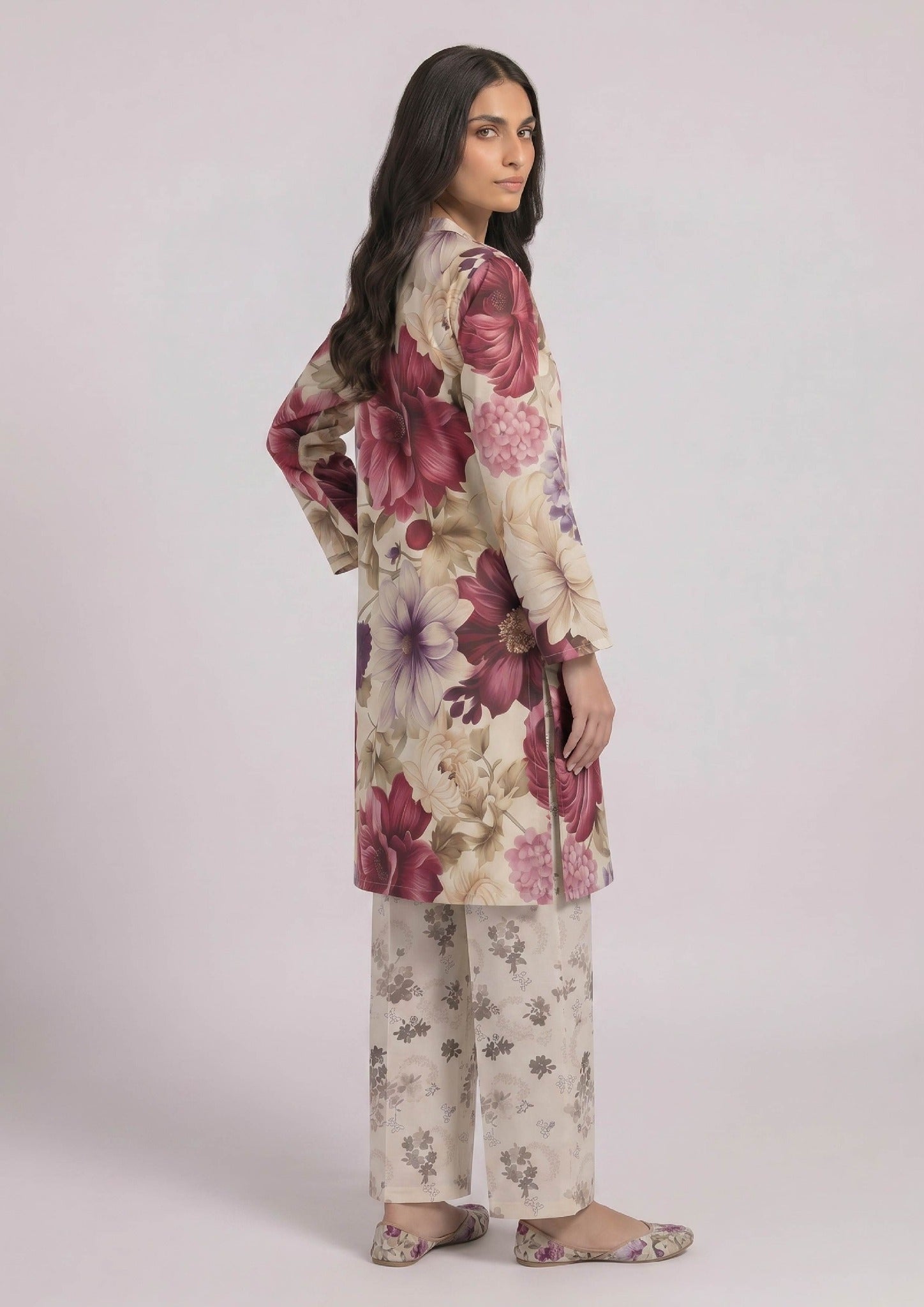 Side view of Ruby Petal printed lawn co-ord set showing the relaxed straight fit, ruby floral print, side slits, and coordinated light floral trouser.