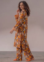 Front view of Retro Rust 2 piece printed lawn co-ord set by Mirasl featuring a knee-down straight shirt, V-style neckline, full sleeves, and wide trouser.