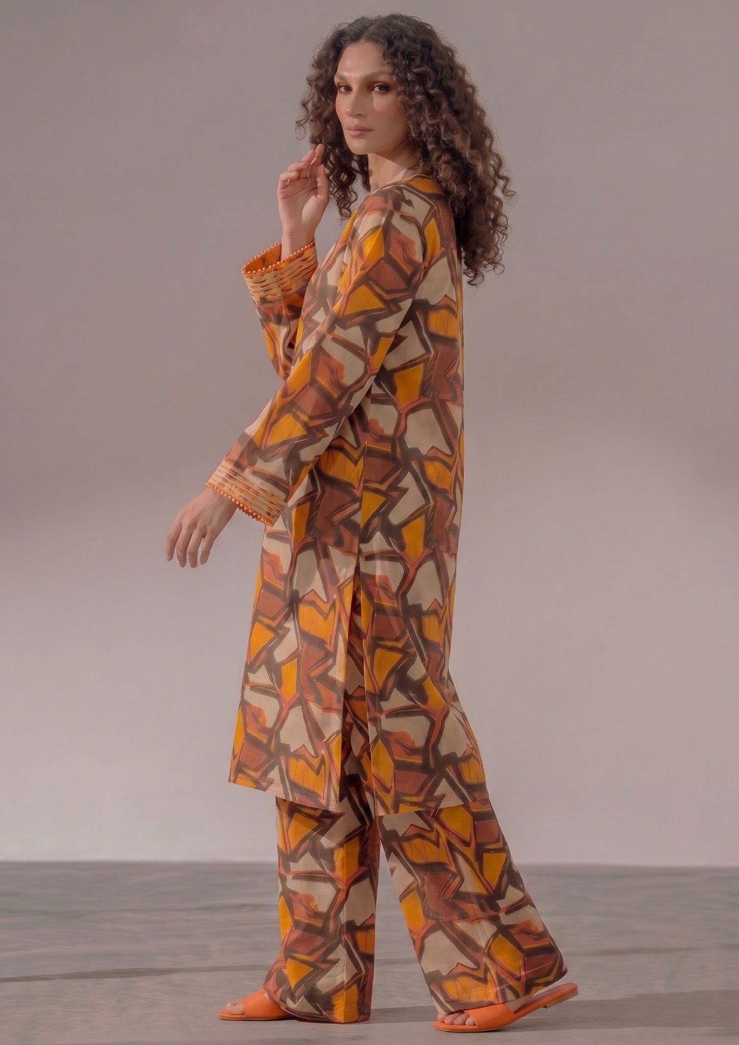 Front view of Retro Rust 2 piece printed lawn co-ord set by Mirasl featuring a knee-down straight shirt, V-style neckline, full sleeves, and wide trouser.