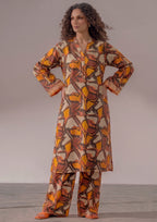 Retro Rust by Mirasl, a rust orange 2 piece printed lawn co-ord set with abstract geometric print, wide trouser, and breathable summer lawn fabric.