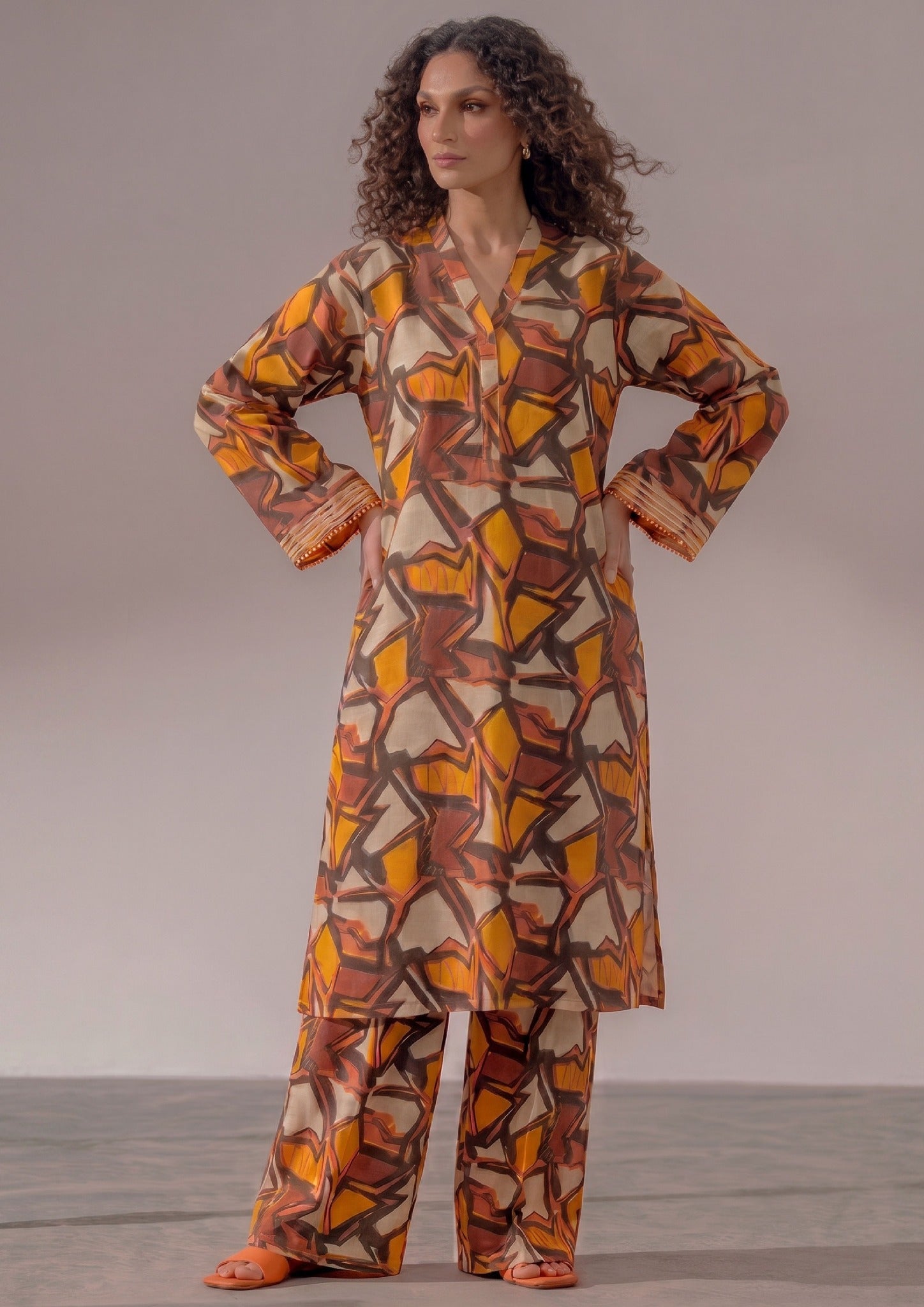 Retro Rust by Mirasl, a rust orange 2 piece printed lawn co-ord set with abstract geometric print, wide trouser, and breathable summer lawn fabric.