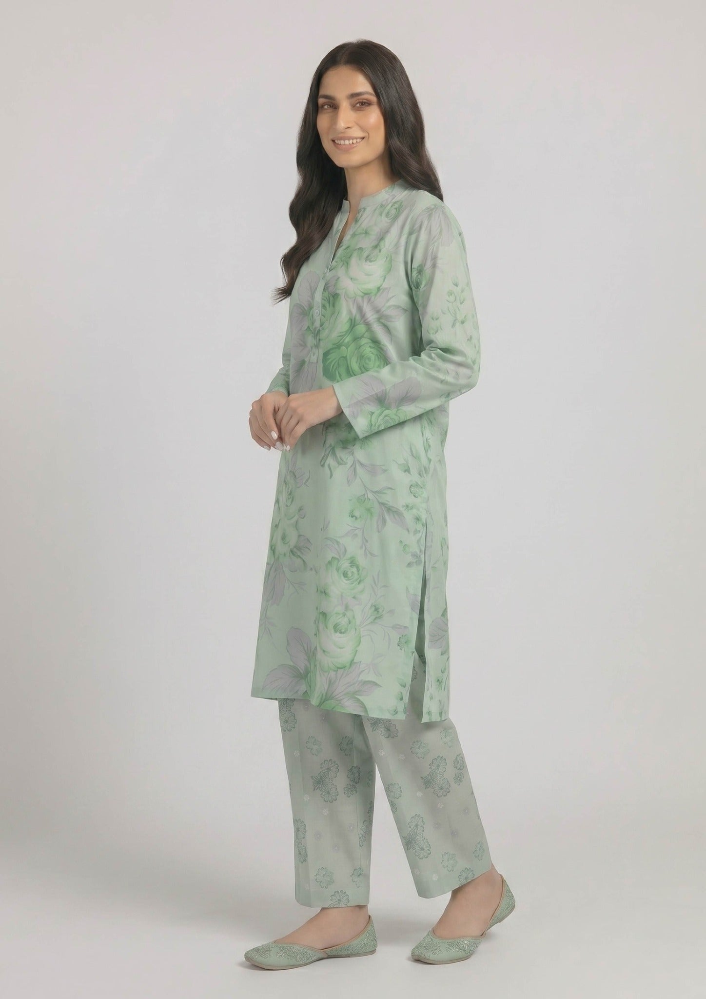 Front view of Mint Meadow 2 piece printed lawn co-ord set by Mirasl featuring a knee-level floral shirt, buttoned neckline, full sleeves, and printed trouser.