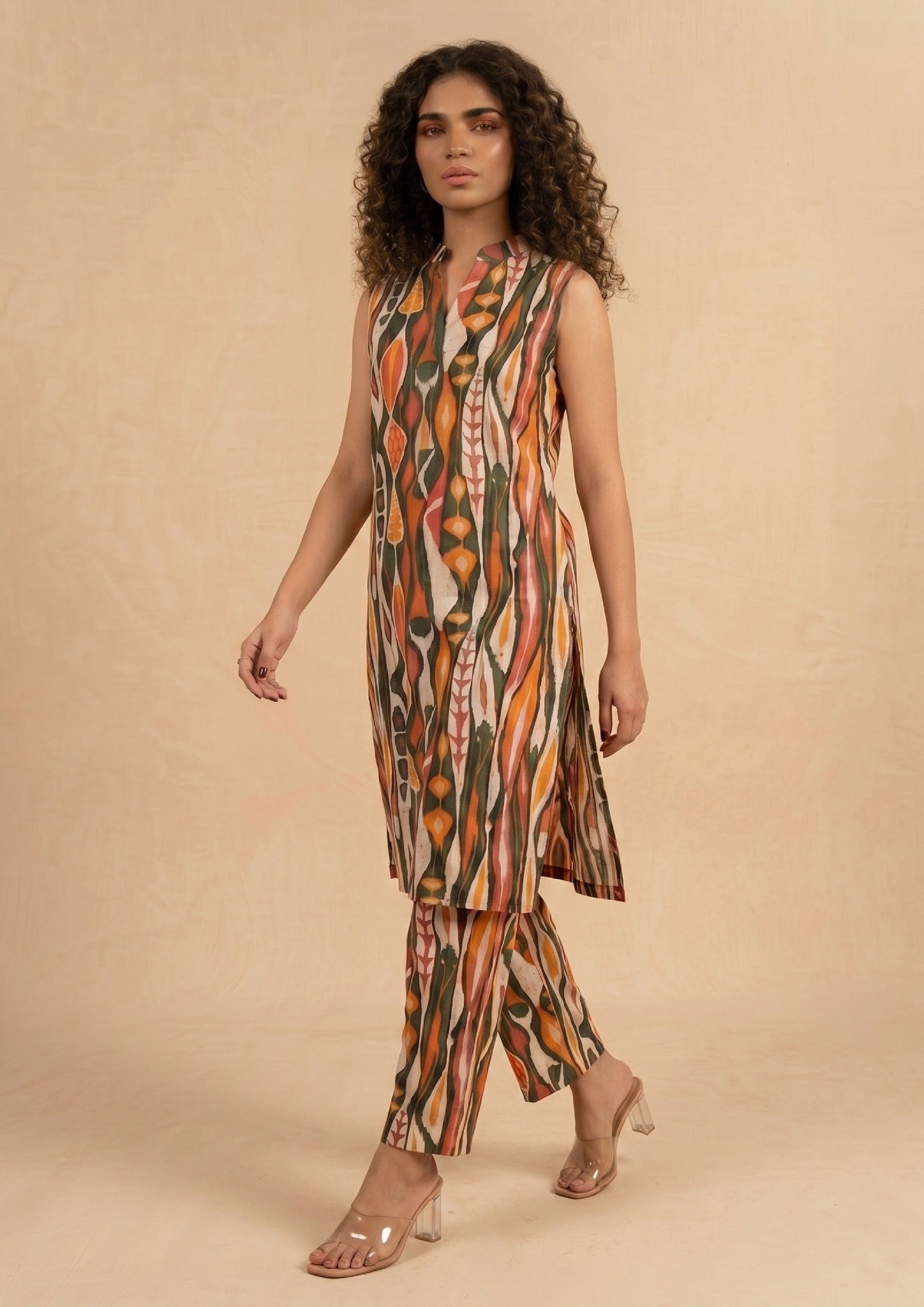 Front view of Linear Illusion 2 piece printed lawn co-ord set by Mirasl featuring a sleeveless knee-level shirt, front slit neckline, and printed trouser.