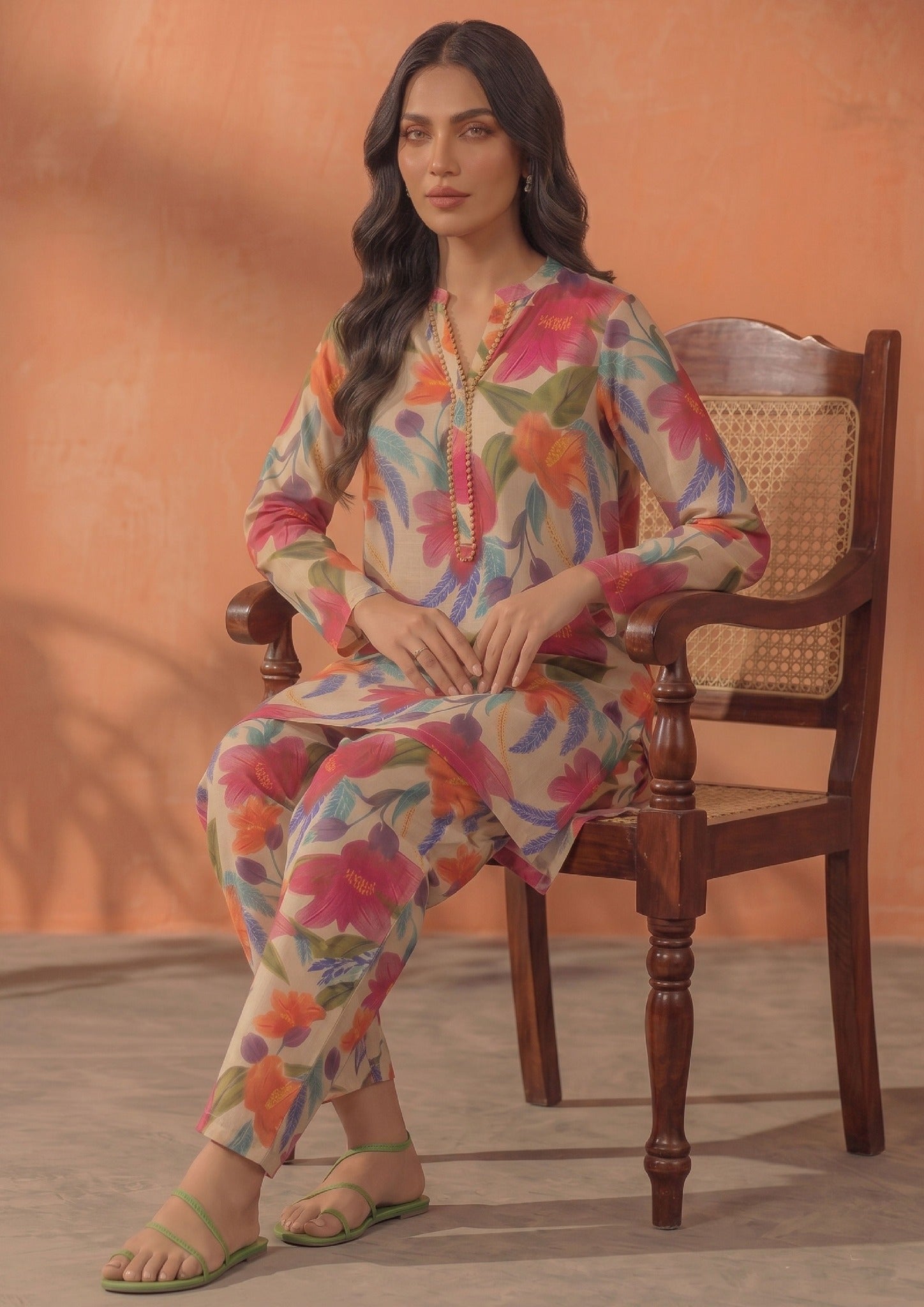 Front view of Ivory Blossom 2 piece printed lawn co-ord set by Mirasl featuring a knee-level floral shirt, V-style neckline, full sleeves, and printed trouser.