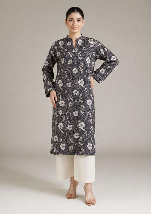 Front view of Evening Meadow 2 piece printed lawn co-ord set by Mirasl featuring a knee-level floral shirt, V-style neckline, full sleeves, and off-white trouser.