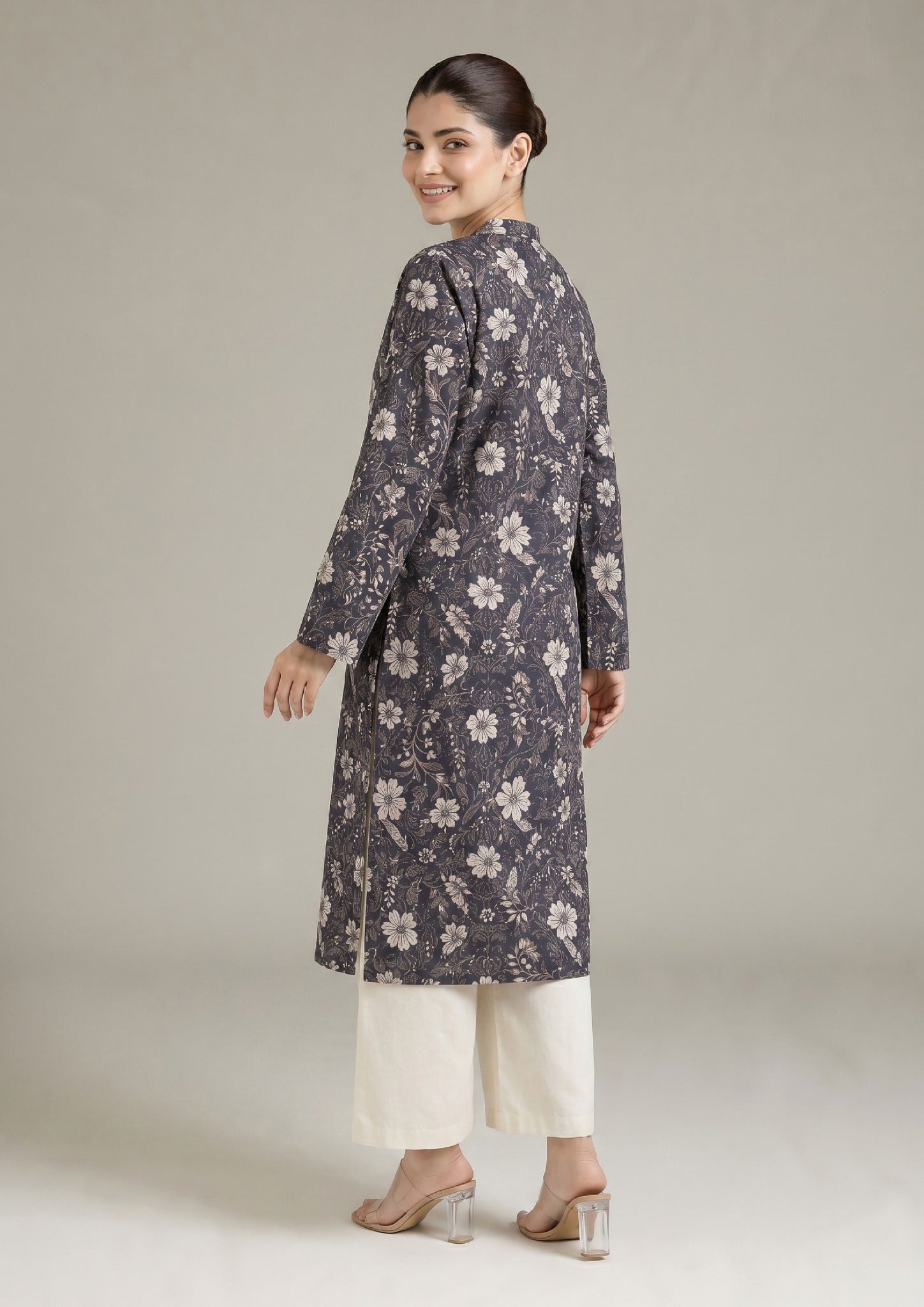 Side view of Evening Meadow printed lawn co-ord set showing the relaxed straight fit, side slits, charcoal grey floral shirt, and coordinated trouser.