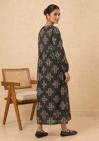 Back view of Ebony Crossroad by Mirasl showing the ebony black printed lawn outfit with off-white cross pattern, long sleeves, gathered waist, and modest relaxed fit.