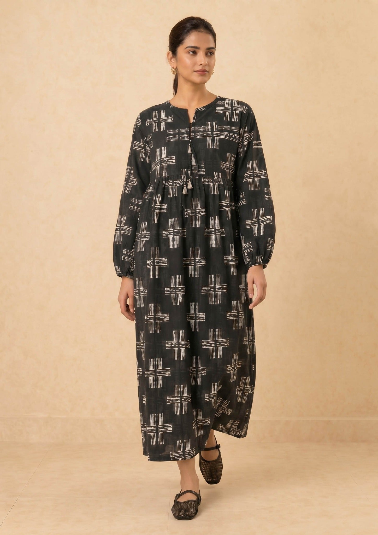 Ebony Crossroad by Mirasl, an ebony black 2 piece printed lawn co-ord set with off-white cross motifs, tassel neckline, relaxed flowy fit, and breathable summer fabric.