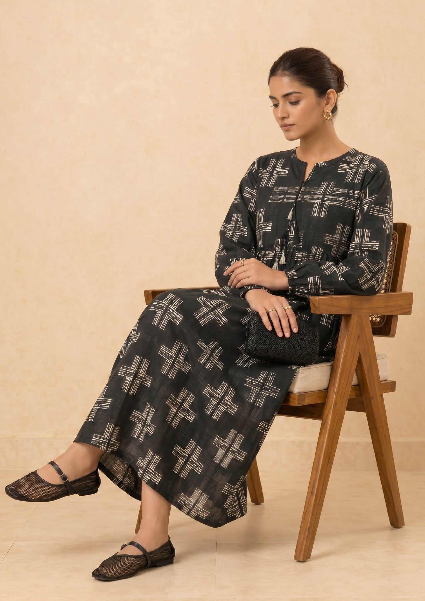 Side view of Ebony Crossroad printed lawn co-ord set by Mirasl featuring a black cross print outfit with soft drape, long sleeves, tassel neckline, and comfortable summer styling.