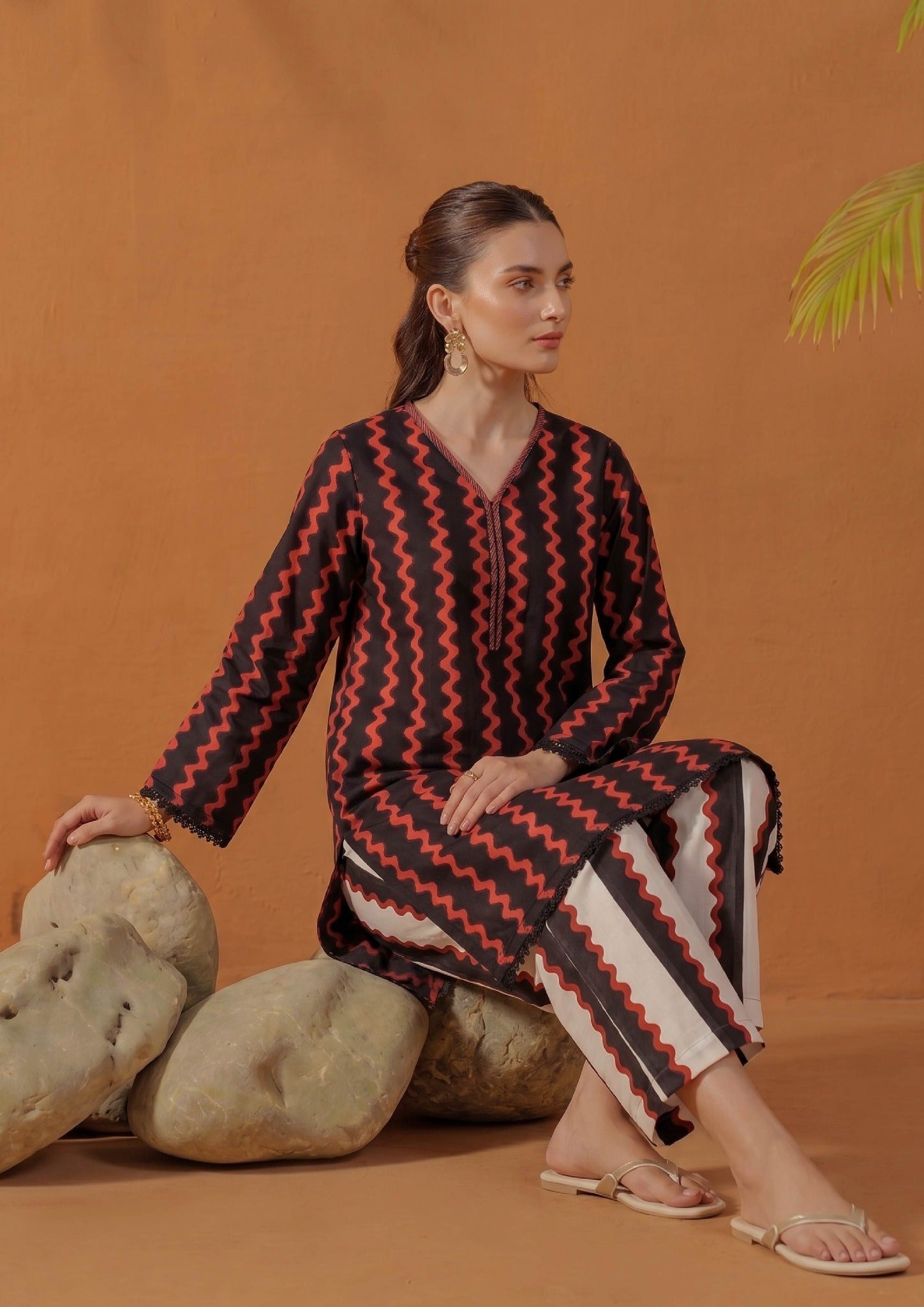 Front view of Crimson Ripple 2 piece printed lawn co-ord set by Mirasl featuring a black shirt with crimson red ripple print, V-neckline, lace hem detail, and coordinated printed trouser.