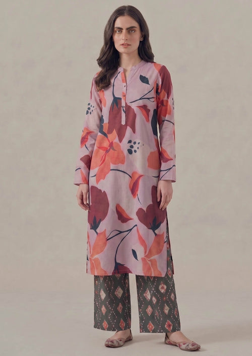 Front view of Crimson Ikat 2 piece printed lawn co-ord set by Mirasl featuring a lilac pink shirt with crimson floral print, band collar, front placket, and charcoal ikat printed trouser.