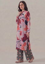 Straight front view of Crimson Ikat by Mirasl showing the knee-level floral printed lawn shirt, long sleeves, button placket detail, relaxed straight fit, and coordinated ikat trouser.