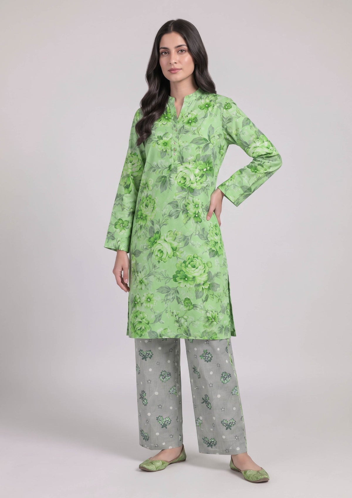 Full-length view of Mint Meadow printed lawn outfit with green floral shirt and coordinated grey trousers by Mirasl