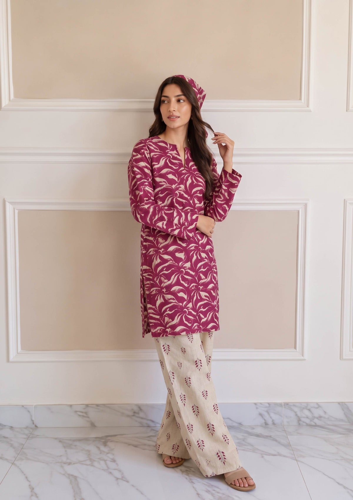 Model wearing Rosabelle magenta printed lawn shirt with ivory printed trousers and matching scarf by Mirasl