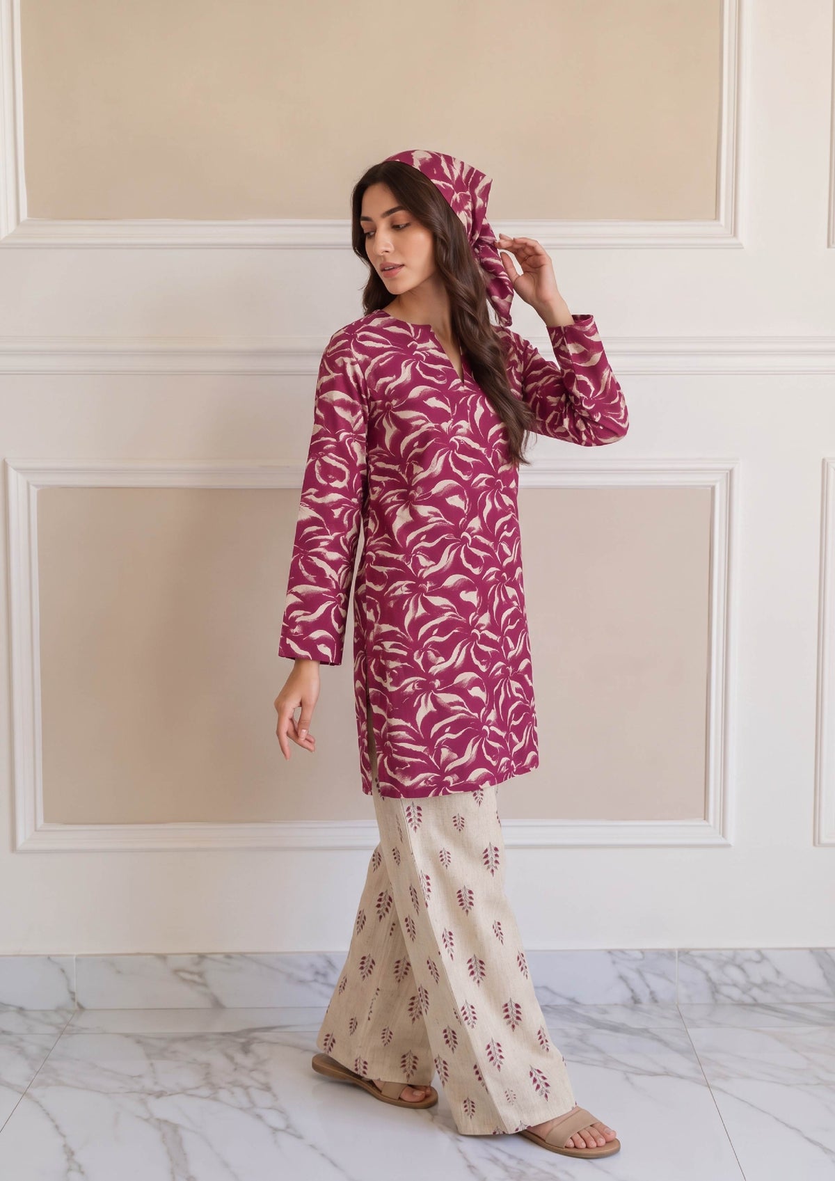 Three-quarter view of Rosabelle printed lawn suit with magenta shirt, matching printed scarf and ivory trousers by Mirasl