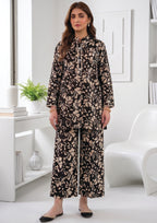 Full front view of Abstract Petal Noir black floral coard suit with pearl-style placket, lace cuffs and coordinated printed trouser
