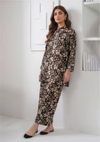 Side standing view of Abstract Petal Noir printed lawn coard suit showing sandy beige abstract petal print and ankle-length trouser