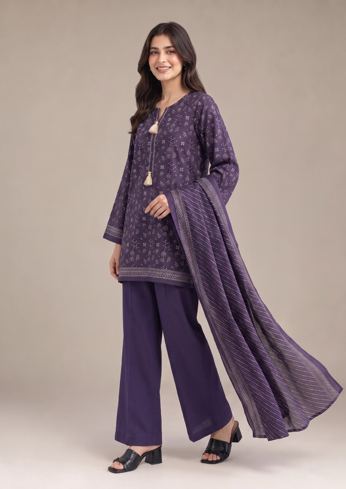 Front walking view of Amethyst Bloom 3 Piece Stitched Lawn Suit with purple Printed Lawn shirt, dyed trousers, and printed dupatta.
