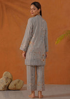 Front view of Mirasl Aura Grey 2 piece printed lawn co-ord set with V-neck border, floral grey shirt and printed straight trouser.