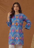 Close-up of Mirasl Azure Oasis printed lawn shirt featuring azure blue base with pink, orange, white, and yellow palm motifs.
