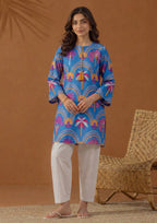 Front full-length view of Mirasl Azure Oasis stitched lawn 2 piece co-ord set with relaxed straight fit shirt and white trouser.