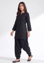 Black Balloon Shalwar by Mirasl in midnight black with relaxed balloon fit and cuffed ankle for modest daily wear