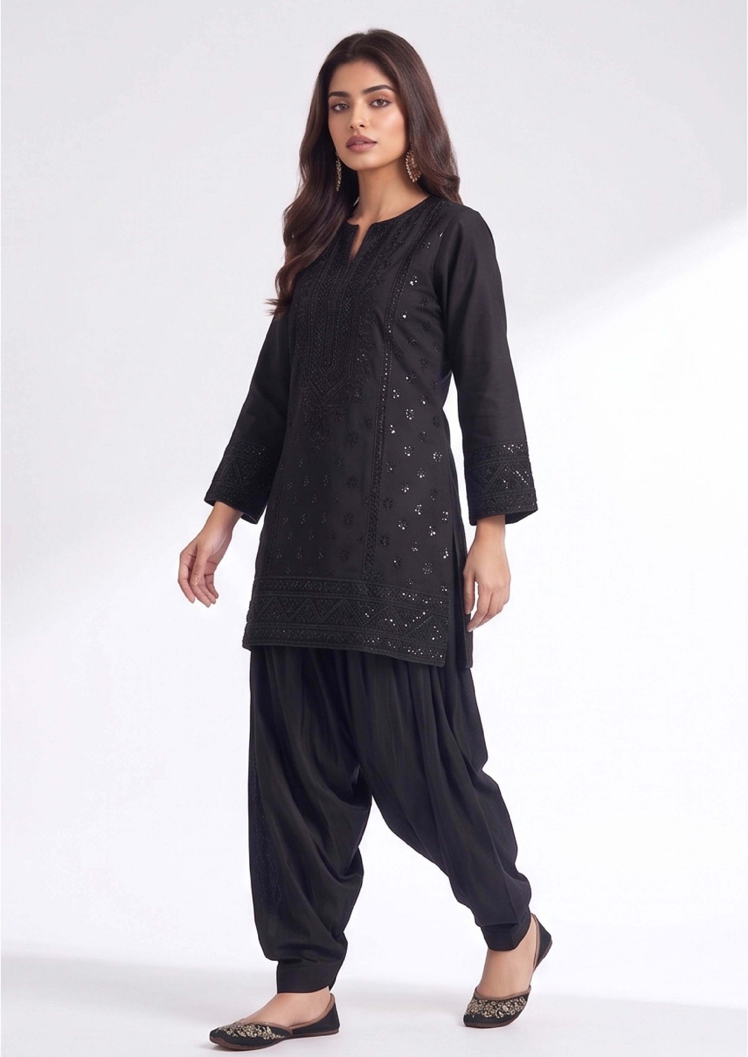 Black Balloon Shalwar by Mirasl in midnight black with relaxed balloon fit and cuffed ankle for modest daily wear