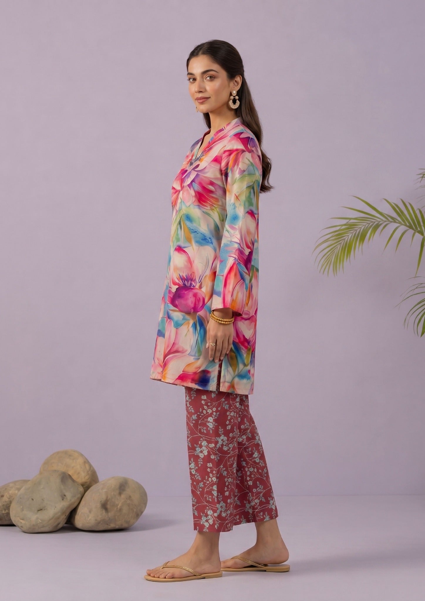 Side view of Mirasl Blossom Bramble printed lawn co-ord set showing knee-level shirt, relaxed fit, and rust red printed trouser.