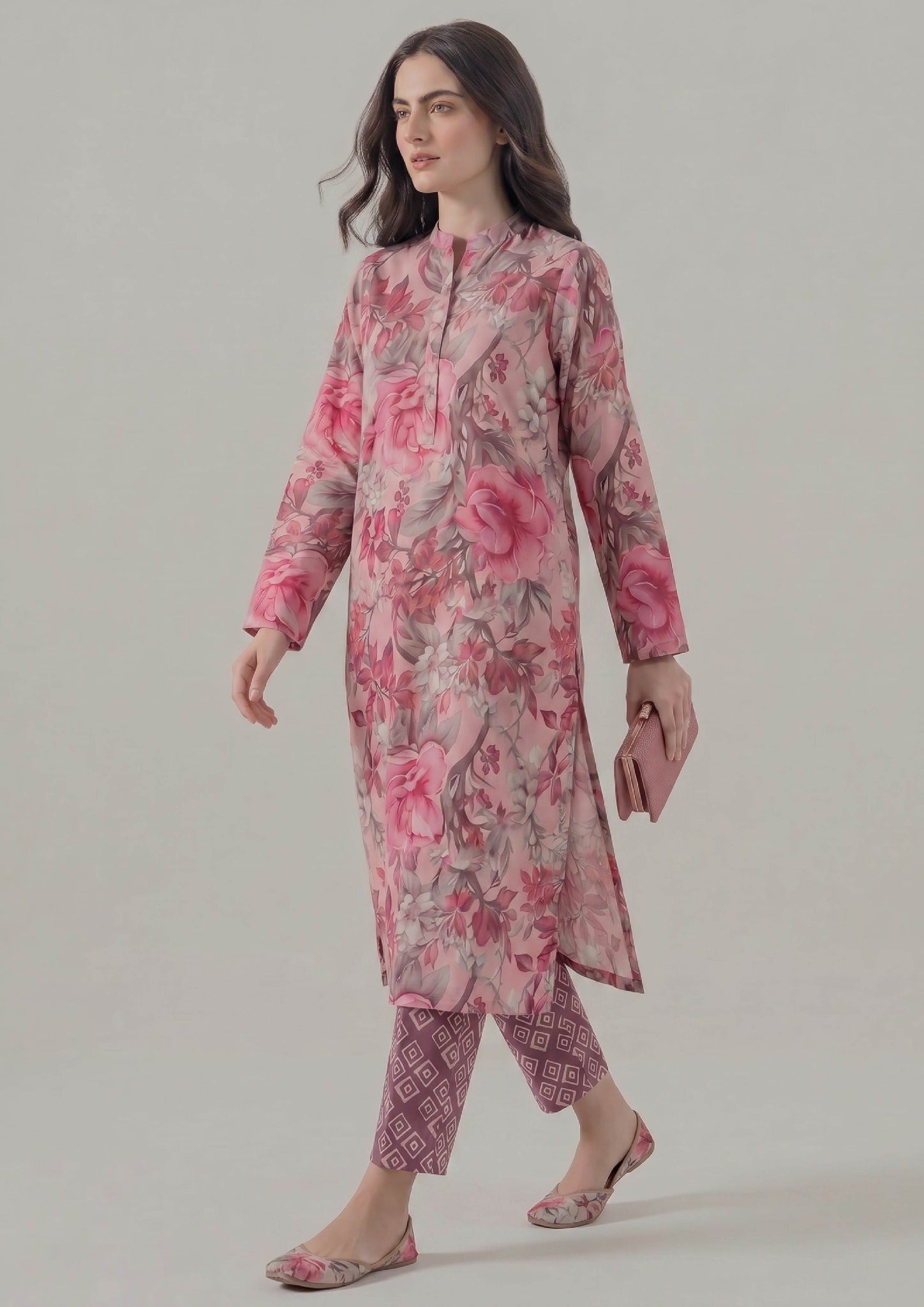 Walking view of Mirasl Blossom Fusion printed lawn co-ord set showing relaxed straight fit shirt, side slits, and printed trouser.