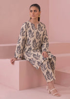 Side view of Botanical Foliage Noir casual 2 piece coard suit by Mirasl with long ivory printed shirt and matching trousers