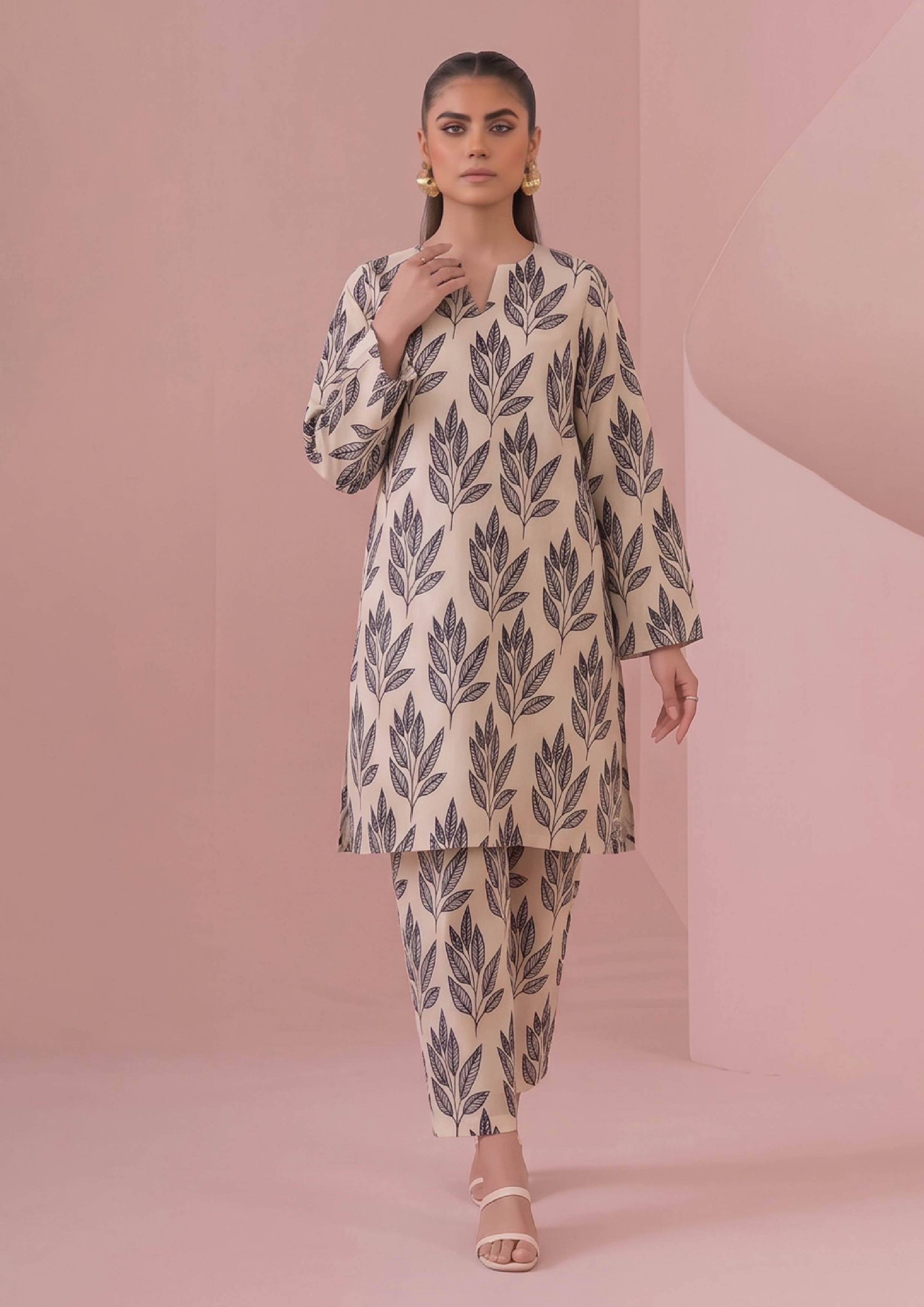 Front view of Botanical Foliage Noir ivory printed lawn suit with black leaf spray design, V notch neckline and matching trousers