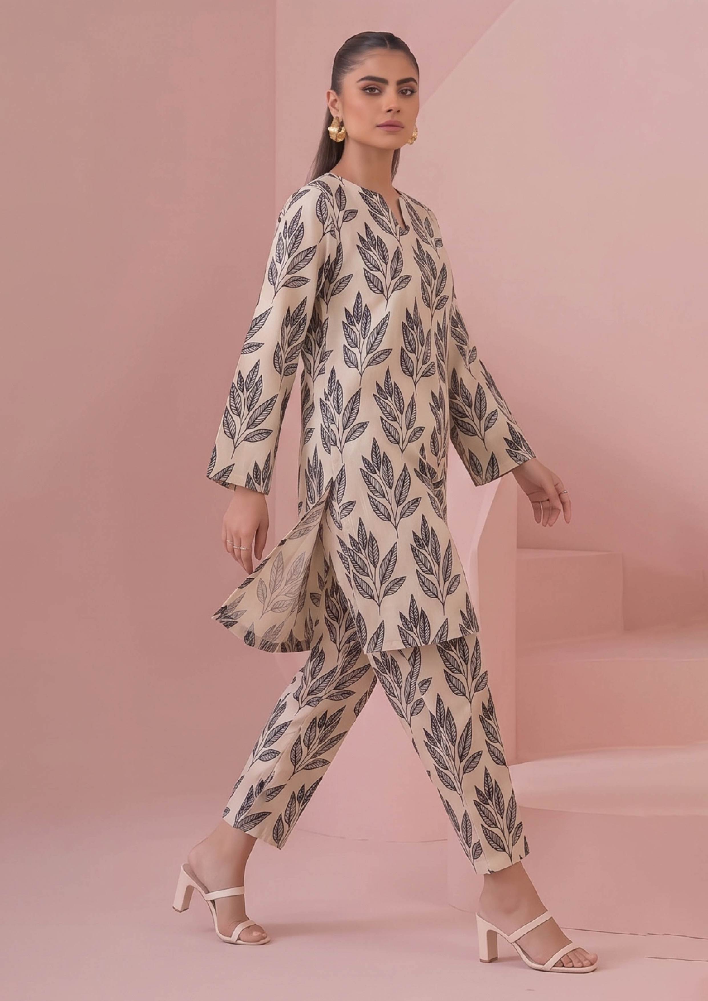 Trouser detail of Botanical Foliage Noir printed coard suit showing coordinated black foliage motifs on premium ivory lawn