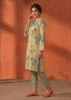 Side view of Mirasl Cerulean Flora stitched lawn 2 piece co-ord set showing relaxed straight fit shirt, side slit, and sage printed trouser.