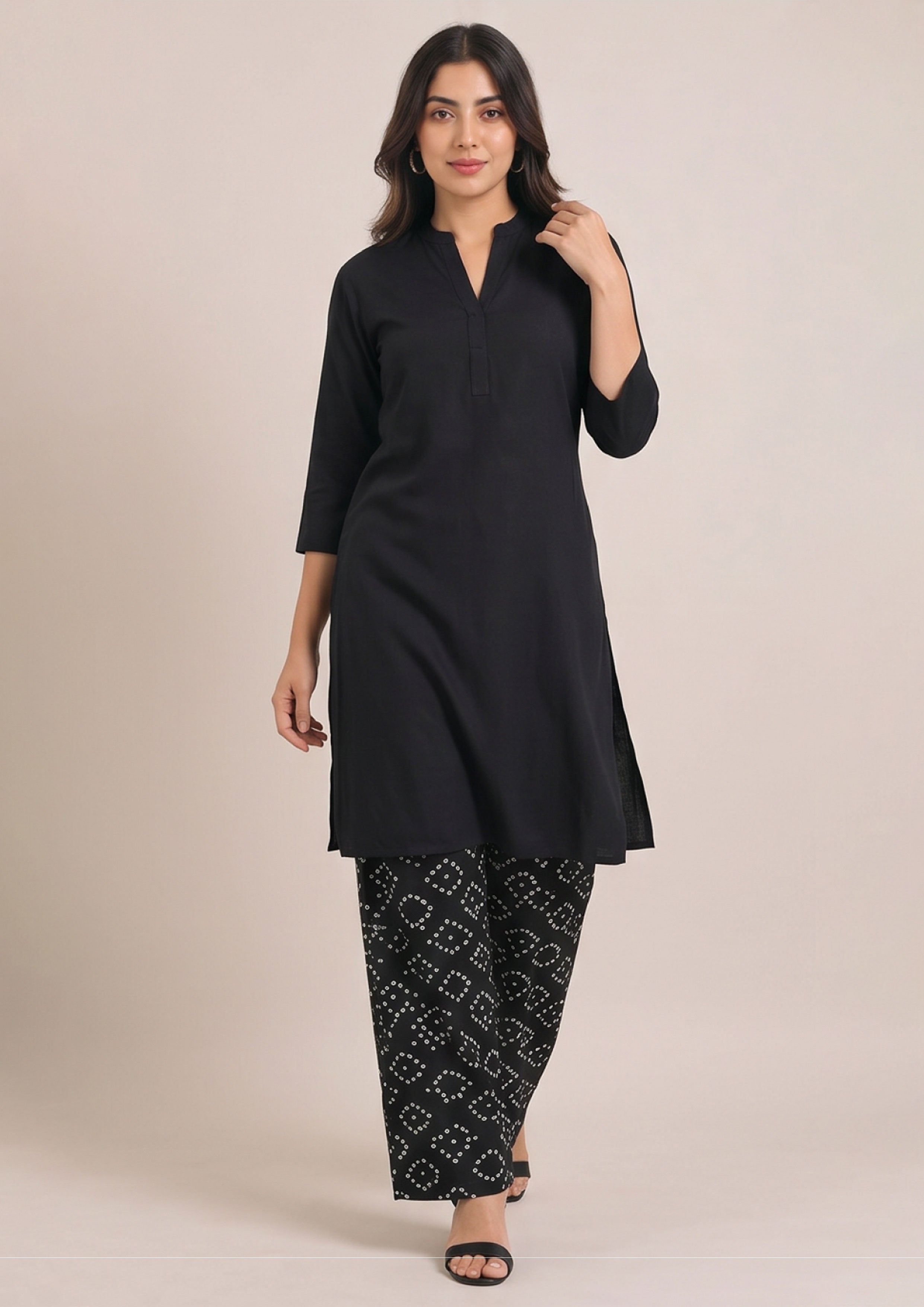 Back view of Chunri Lounge Noir printed trouser coard suit with plain black long shirt and white chunri wide-leg trouser