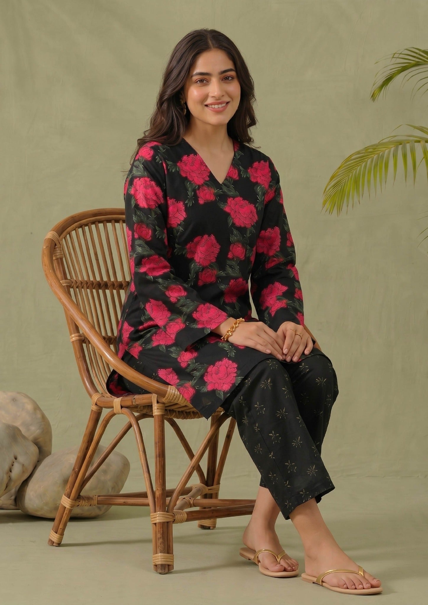 Front view of Mirasl Dark Blossom printed lawn co-ord set with V-neck shirt, red floral print and black straight trouser.