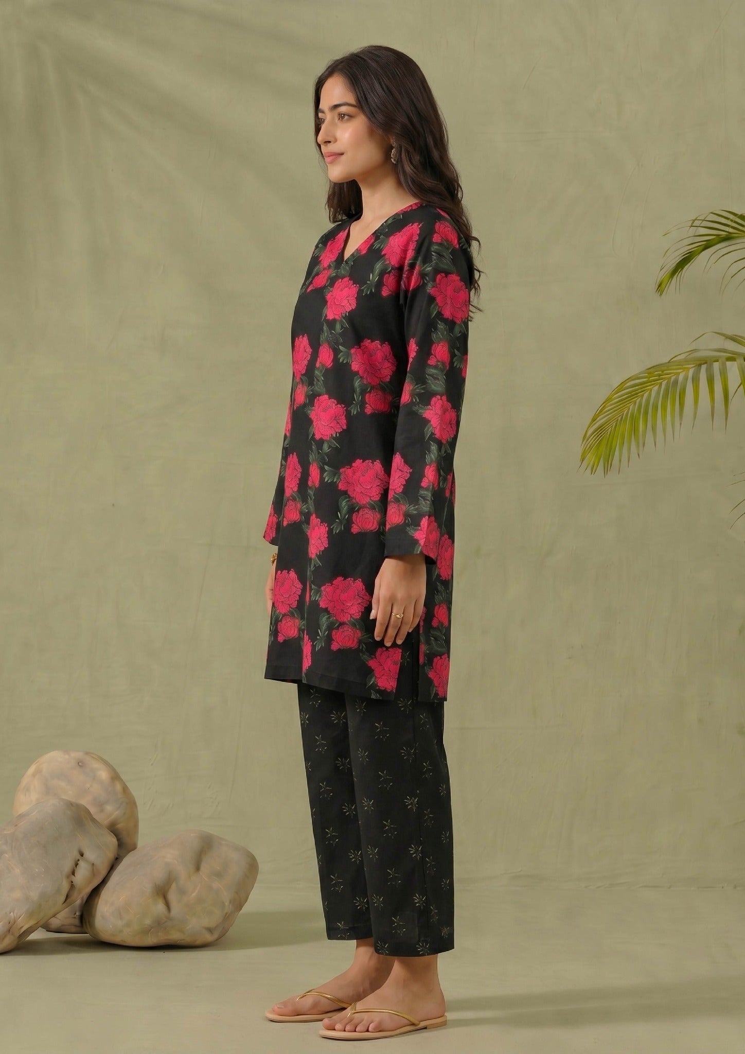 Side view of Mirasl Dark Blossom printed lawn co-ord set showing black red floral knee-level shirt and printed trouser.