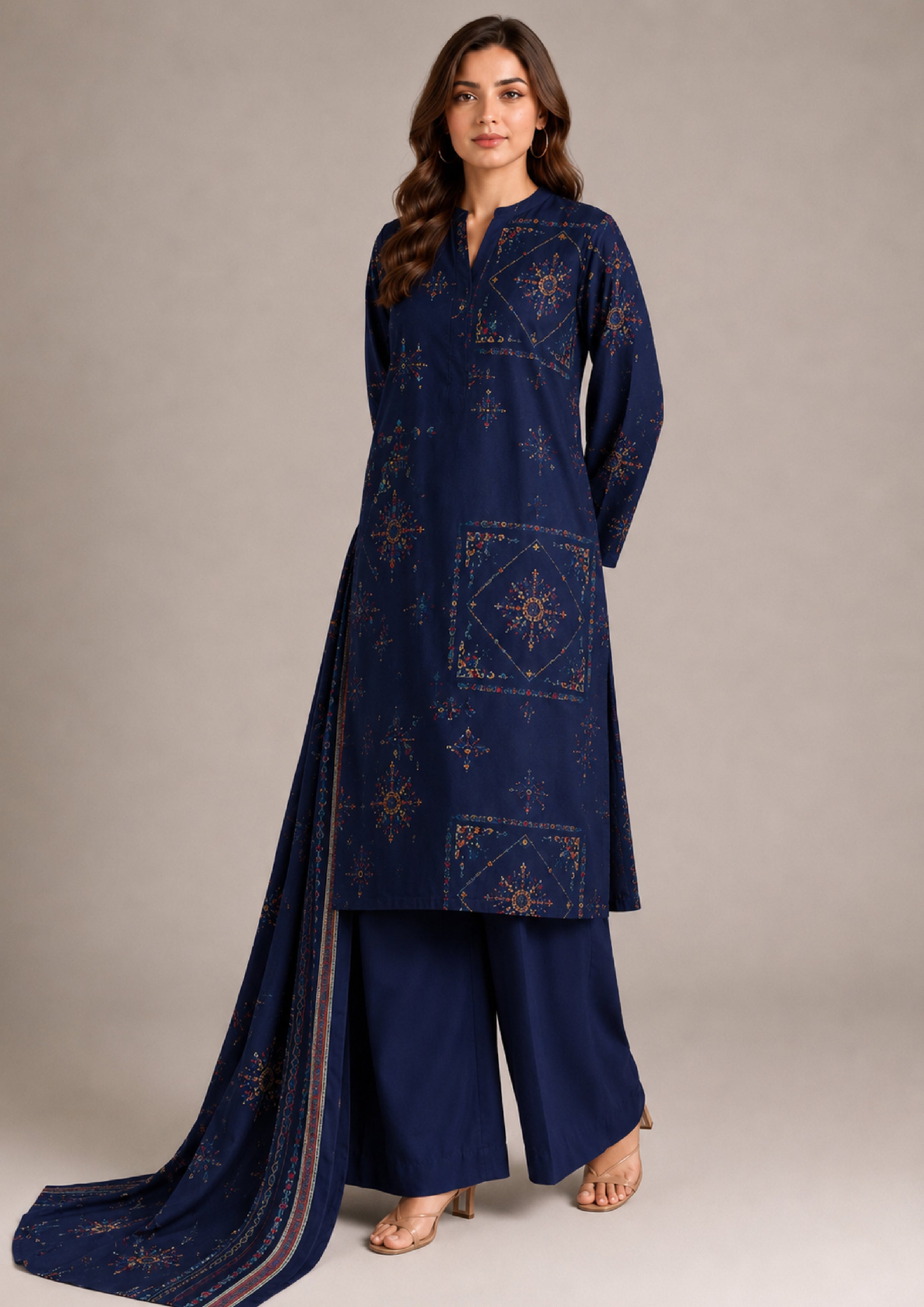 Walking pose of deep navy blue printed lawn 3-piece suit featuring geometric floral print, matching bordered dupatta and solid navy trousers from Mirasl Fasl-e-Rang collection.