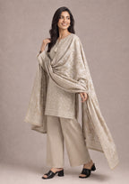 Draped styling view of Desert Sands printed lawn suit showcasing the coordinated printed lawn dupatta, tassel neckline and matching printed trouser by Mirasl.