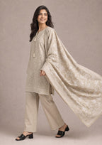 Walking lifestyle pose of Desert Sands 3 Piece Stitched Printed Lawn Suit highlighting the flowing printed dupatta, straight silhouette and breathable lawn fabric.