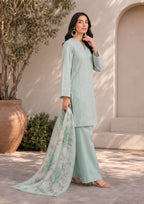 Sophisticated side standing pose featuring a mint green embroidered lawn suit with a white floral printed dupatta and mint green palazzo trousers for contemporary Pakistani women's fashion – fasl-e-rang – mirasl