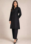 Side view of Essential Pintuck Noir black 2 piece coard suit with long pintuck shirt, side slit and straight-cut trouser