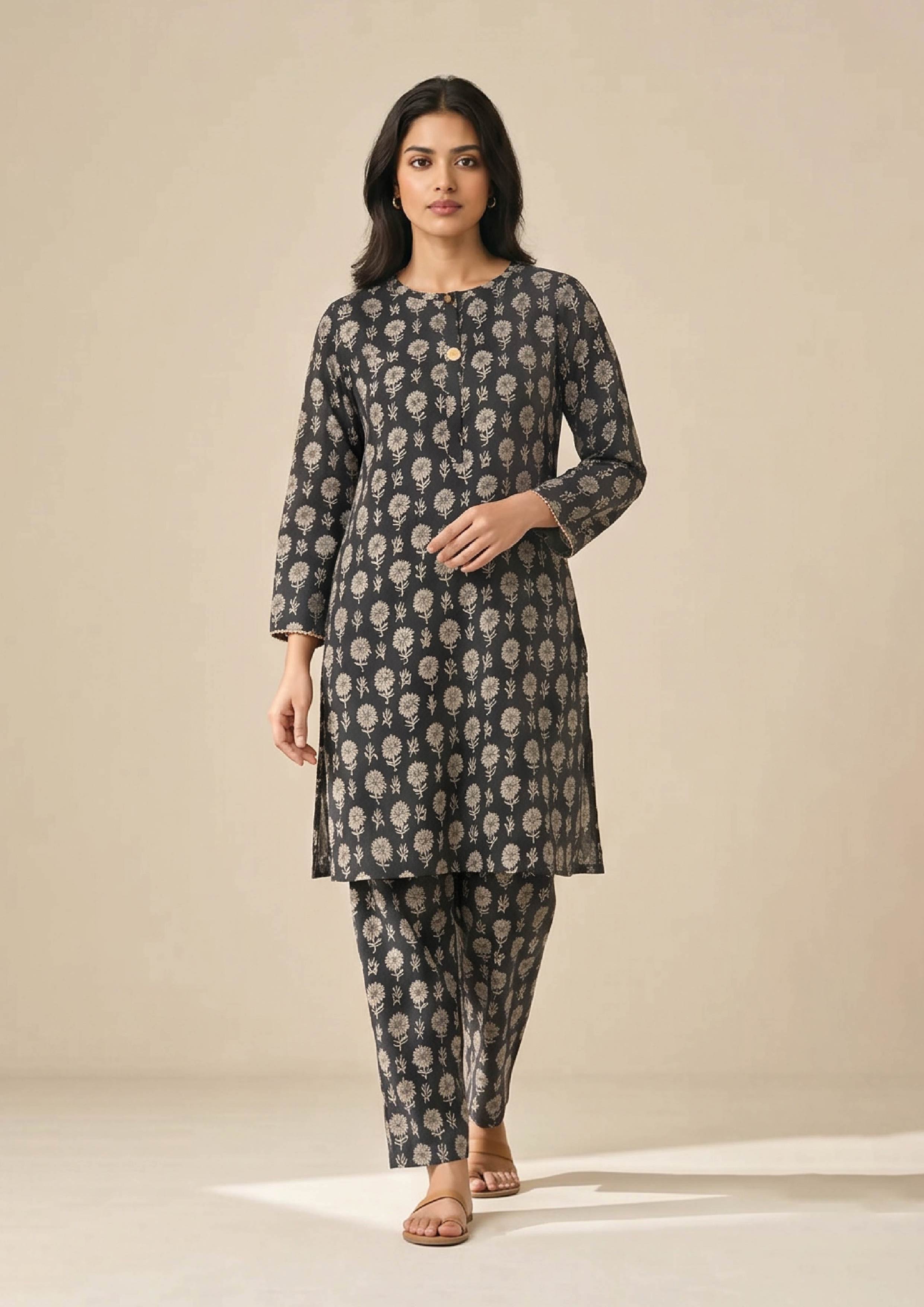 Side profile of Floral Co-ord Noir ivory floral print coard suit showing long shirt side slit and matching trouser