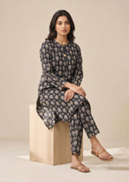Standing front pose of Floral Co-ord Noir women co-ord set showing ivory botanical print on black lawn shirt and trouser