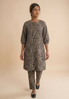 Side view of Golden Print Co-ord printed 2 piece ready to wear suit with quarter puff sleeves and coordinated trouser