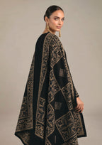 Side view of Gilded Noir stitched lawn suit showing antique gold motifs, long kurta and wide-leg trouser