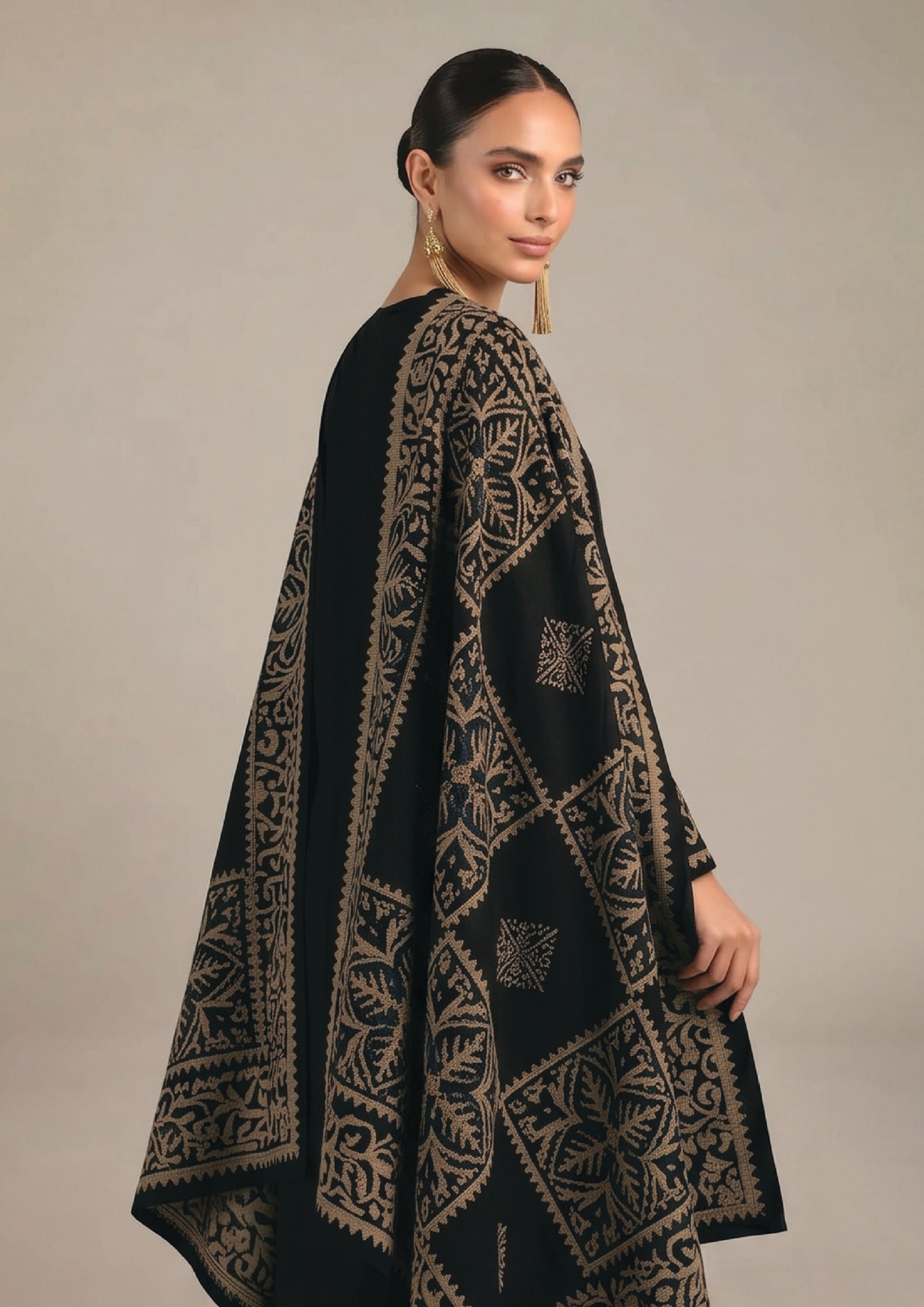 Side view of Gilded Noir stitched lawn suit showing antique gold motifs, long kurta and wide-leg trouser