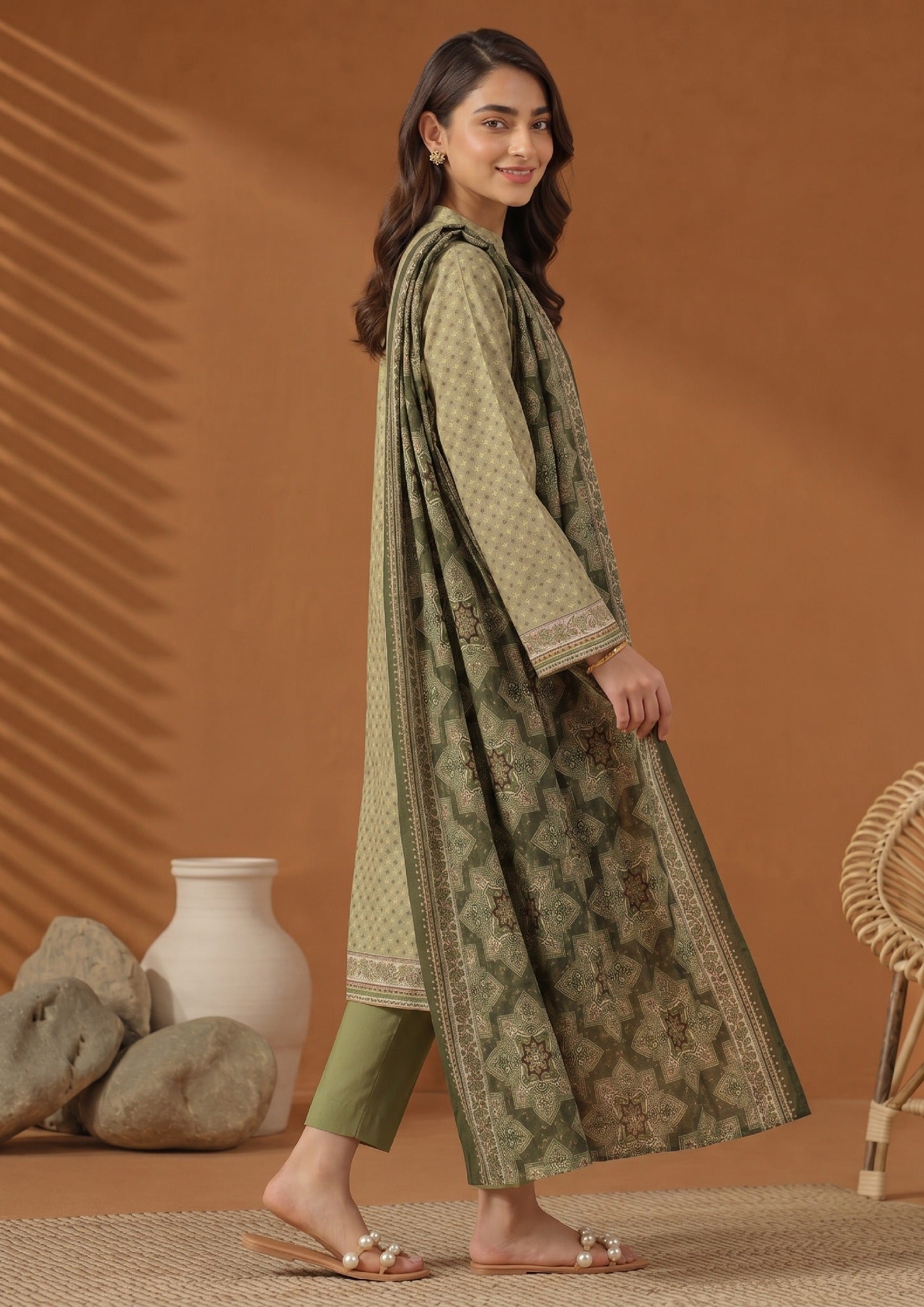 Side profile of Green Dotted 3 Piece Stitched Lawn Suit with printed dupatta by Mirasl